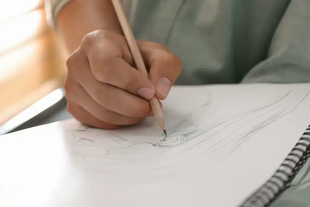 A hand drawing with a pencil in a sketchbook. Child and teen therapy near Tigard, Oregon.
